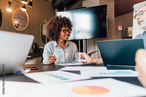 Italy, Business people having meeting in creative studio