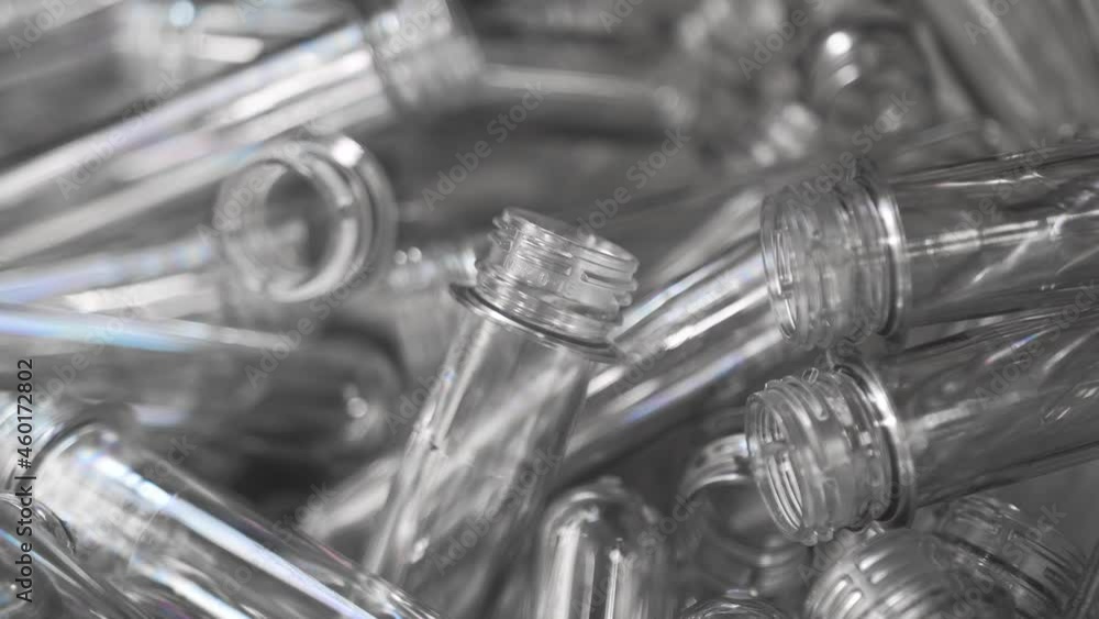 Plastic transparent blanks neck from bottle, travel along conveyor belt, warm up, swell, increase, stamped full, large size. Automated production bottling drinking water, production bottles Plastic transparent blanks neck from bottle, travel along conveyor belt, warm up, swell, increase, stamped full, large size. Automated production bottling drinking water, production bottles