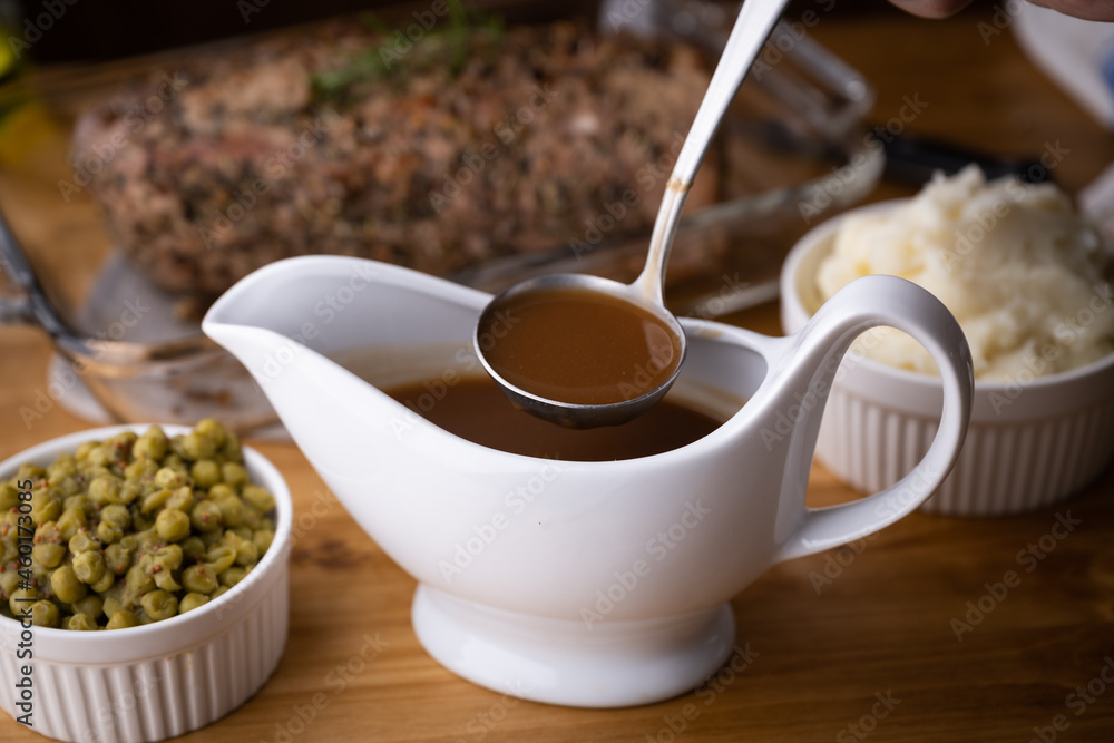 gravy sauce in sauce pod with mashed potato gravy sauce in sauce pod with mashed potato