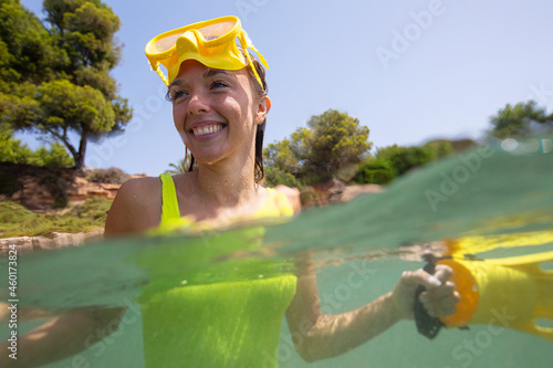 Spain, Mallorca, Smiling woman in scuba mask in sea photo