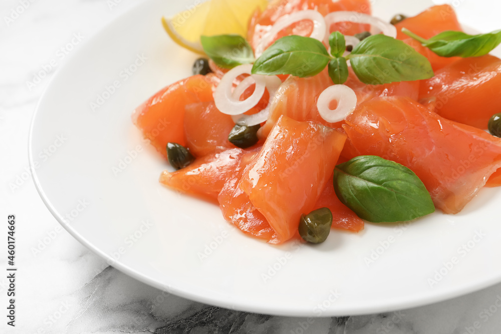 Delicious salmon carpaccio served on white marble table, closeup Delicious salmon carpaccio served on white marble table, closeup