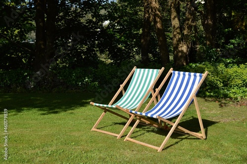 Deck chairs on lawn in summer
