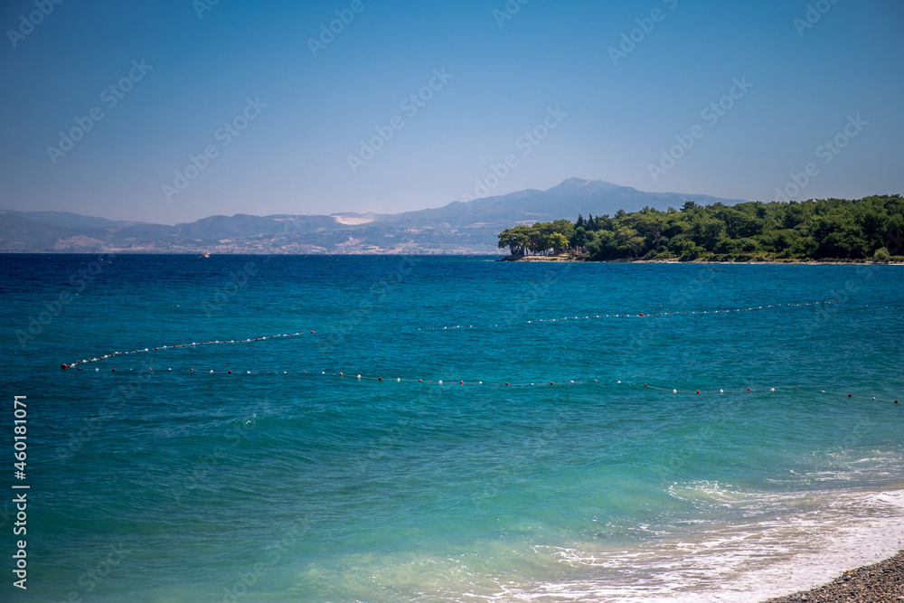 Blue sea on the Turkish coast. Azure water and blue sky. Dilek National Park, Kusadasi, Turkey