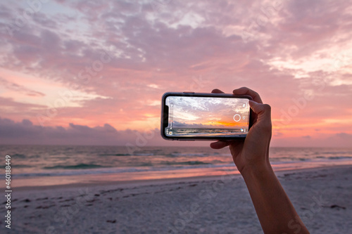 Taking A Photo on a Phone of  the Beach at Sunset in Florida on the West Coast
