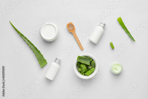 Different cosmetic products with aloe on light background © Pixel-Shot