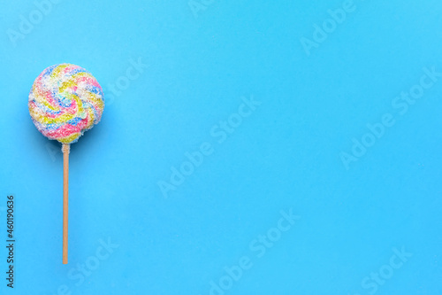 Sweet lollipop on color background