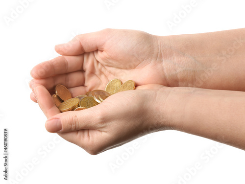 Female hands with coins on white background