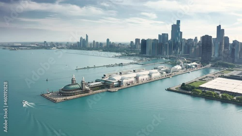 Chicago Navy Pier with at cinematic blue Michigan lake on scenic downtown skyline motion background. Copy space on blue sky and water background. 4K footage Chicago Illinois USA summer footage photo