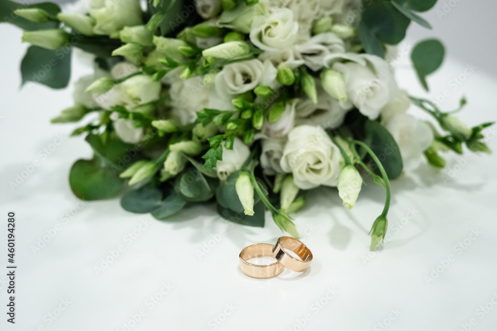 wedding rings and bouquet of roses wedding rings and bouquet of roses