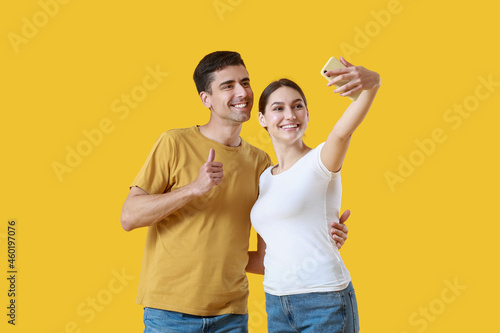 Young couple taking selfie ...