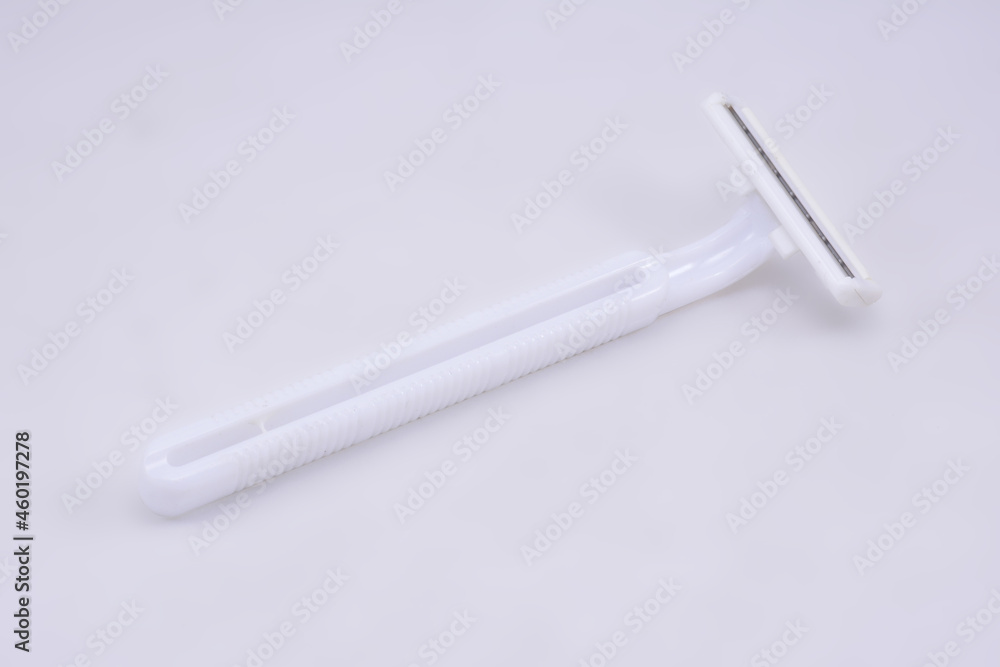 White plastic disposable razor facial hair shaver White plastic disposable razor facial hair shaver
