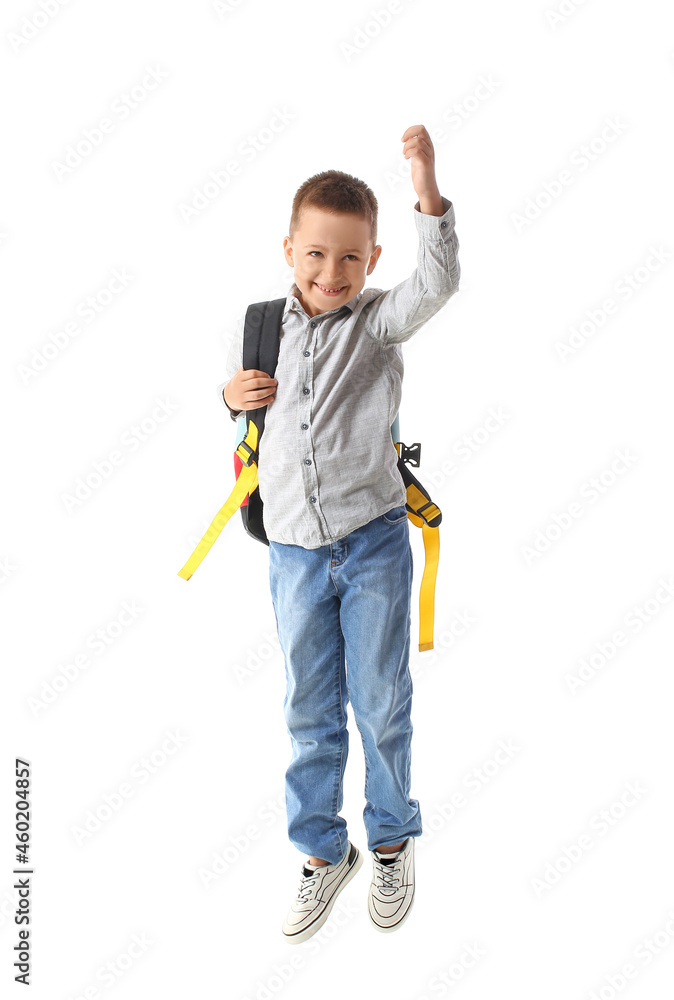 Jumping little schoolboy on white background Jumping little schoolboy on white background