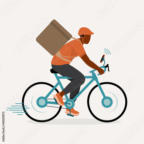 Young Black Delivery Man With Thermal Insulated Bag Riding Bicycle With Smartphone Attached To Bike. Delivery And Logistic Services.