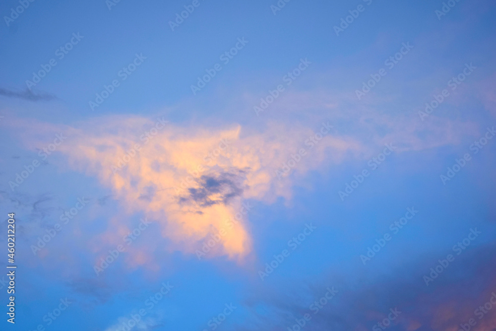 The beautiful scenery consists of orange clouds and blue sky.