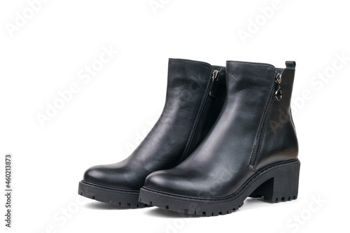 Black leather ankle boots for women made of leather isolated on a white background.