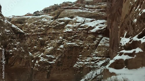 Amazing view of snowy mountain. Shot taken from inside a car that is driving on a mountain road in speed. Beautiful natural landscape and mountain snowfall. photo