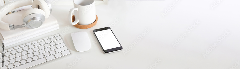 Minimal workspace with smart phone, coffee cup, headphone and books on white table. Minimal workspace with smart phone, coffee cup, headphone and books on white table.