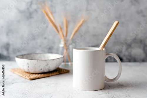 Coffee mug mockup, boho or kitchen themed mug mock up, neutral tones. Concept branding mock up for logo or design.