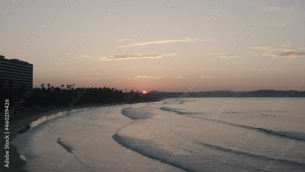 Waves in the ocean during sunset in Weligama Bay in Sri Lanka. Aerial cinematic footage Waves in the ocean during sunset in Weligama Bay in Sri Lanka. Aerial cinematic footage
