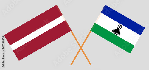 Crossed flags of Latvia and the Kingdom of Lesotho. Official colors. Correct proportion photo