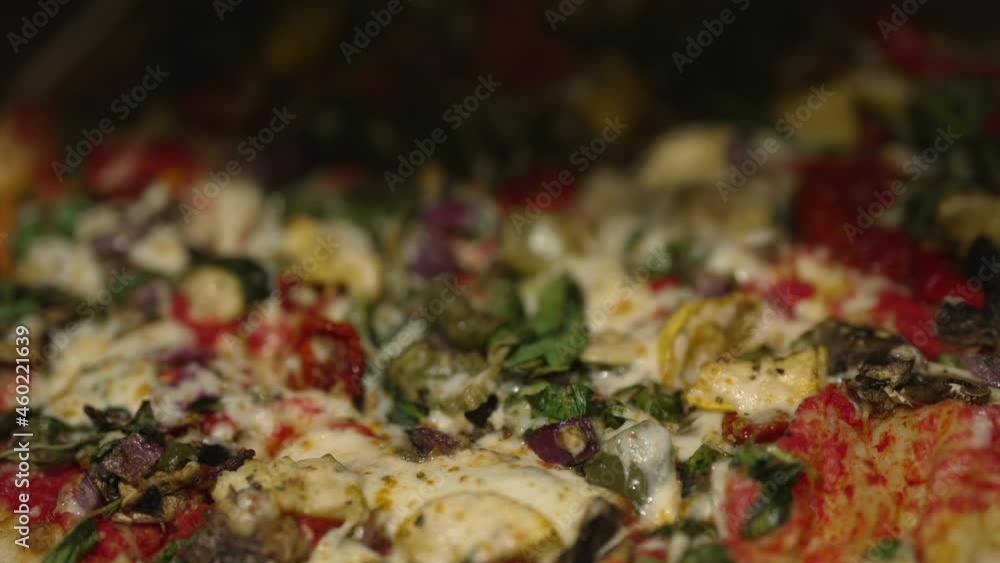 This slow motion video shows a close up, POV view of a pizza box opening and revealing a delicious artisan pizza loaded with fresh toppings. This slow motion video shows a close up, POV view of a pizza box opening and revealing a delicious artisan pizza loaded with fresh toppings.