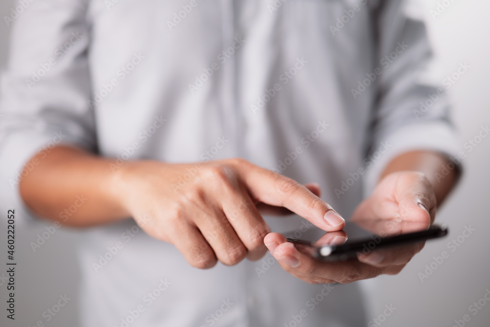 Man hand using black smartphone. Advertising concept Man hand using black smartphone. Advertising concept