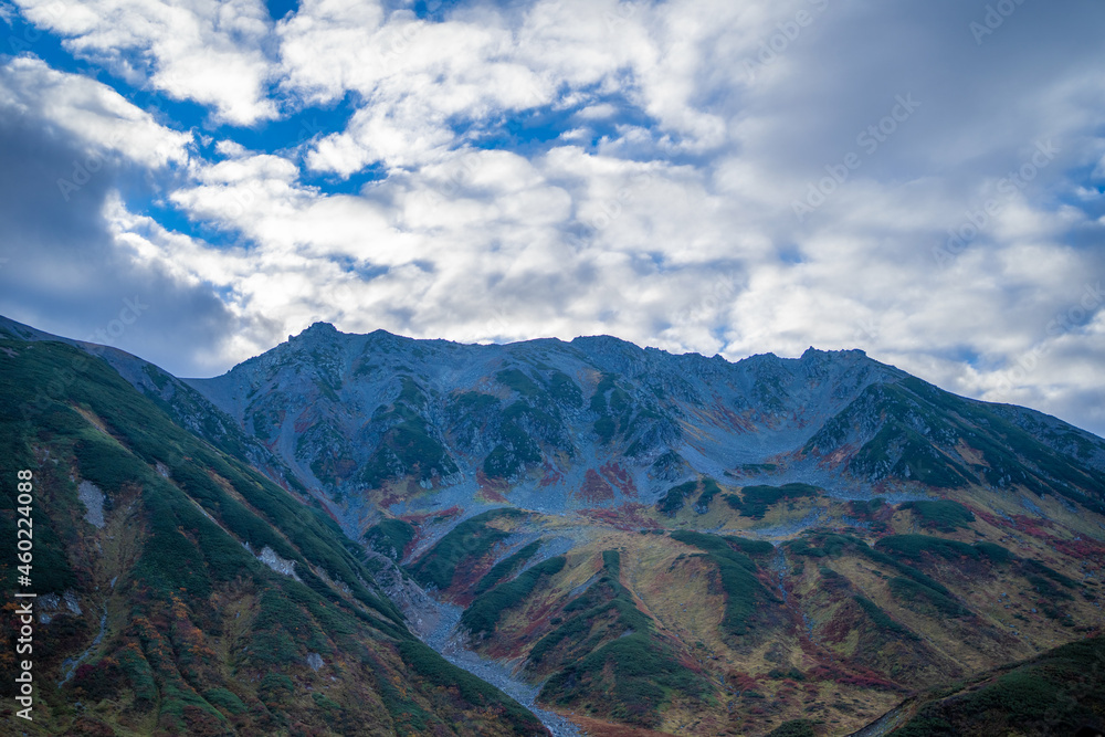 富山県立山町の立山の秋の紅葉の季節に登山している風景 Scenery of climbing Tateyama Mountain in Tateyama Town, Toyama Prefecture, Japan during the season of autumn leaves. 富山県立山町の立山の秋の紅葉の季節に登山している風景 Scenery of climbing Tateyama Mountain in Tateyama Town, Toyama Prefecture, Japan during the season of autumn leaves.