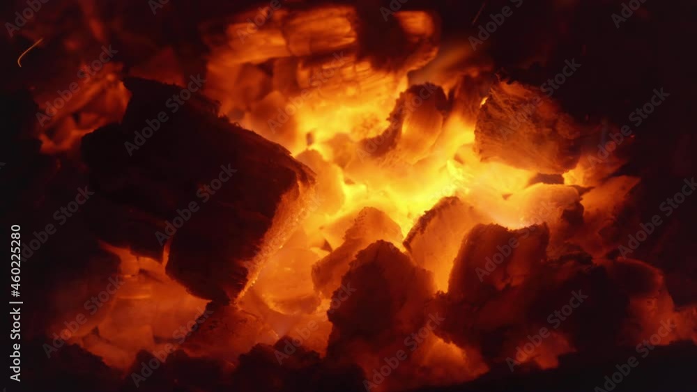 Closeup Of Wood And Embers In The Ablaze Fireplace. Macro Closeup Of Wood And Embers In The Ablaze Fireplace. Macro