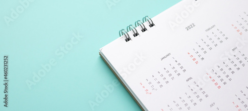2022 calendar page on blue background business planning appointment meeting concept photo