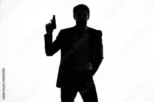 businessmen gun in the hands of the emotions silhouette isolated background