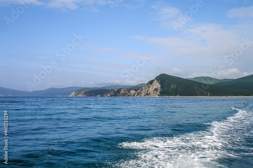 View of the sea shore with mountains and beaches, the water with a wave. Seascape, Japan Sea, Far East, Petrov Island