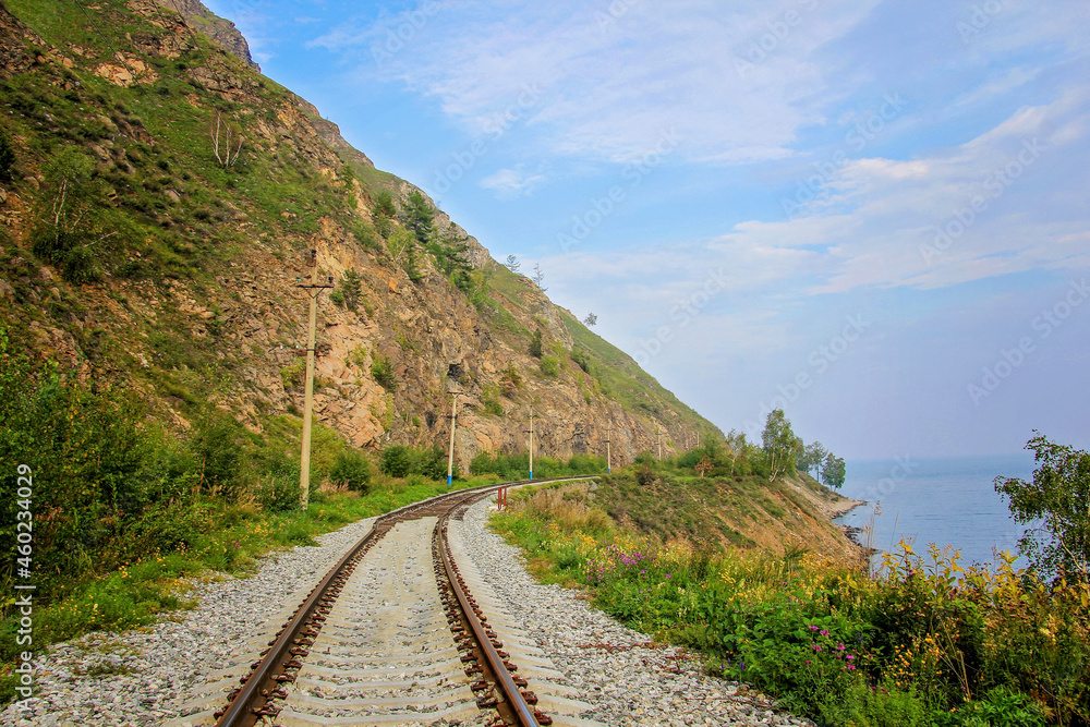 Around Lake Baikal railway near Slyudyanka. Siberian railway track with retaining wall, viaduct, tunnel