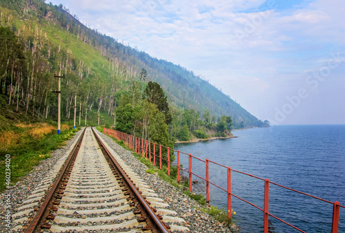 Around Lake Baikal railway near Slyudyanka. Siberian railway track with retaining wall, viaduct, tunnel