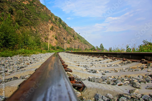 Around Lake Baikal railway near Slyudyanka. Siberian railway track with retaining wall, viaduct, tunnel photo