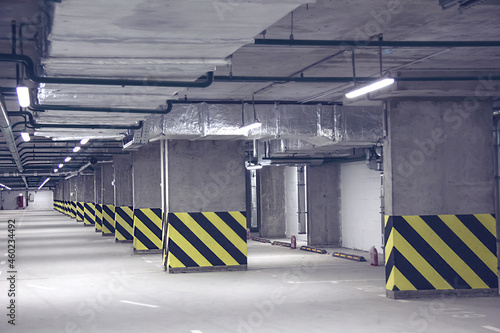 Empty parking place in a residential building. Covered underground parking for cars