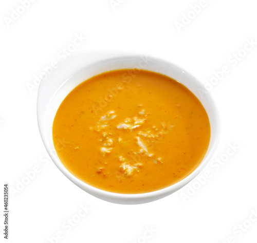 red curry in ceramic cup on white background