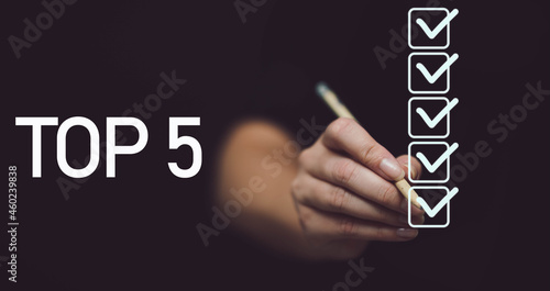 
Hand writing Top 5. 5 checkmarks on black background