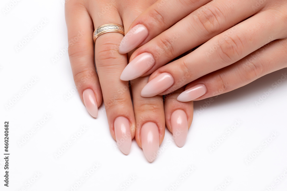 Wedding manicure white ombre on long sharp nails close-up on a white background Wedding manicure white ombre on long sharp nails close-up on a white background