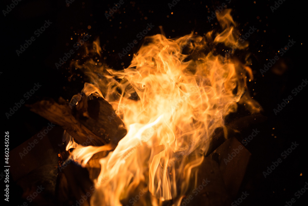 Obraz premium Fire creates endless shapes as it burns, flames and black backgrounds create interesting textures. Flame of Hell. Combustion power.