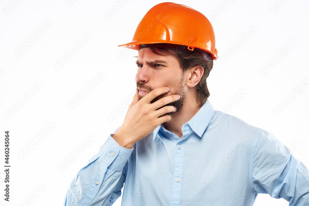 emotional man orange helmet on the head Studio hand gesture emotional man orange helmet on the head Studio hand gesture