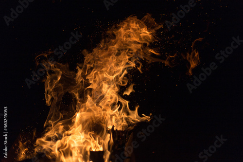 Fire creates endless shapes as it burns, flames and black backgrounds create interesting textures. Flame of Hell. Combustion power. © donikz