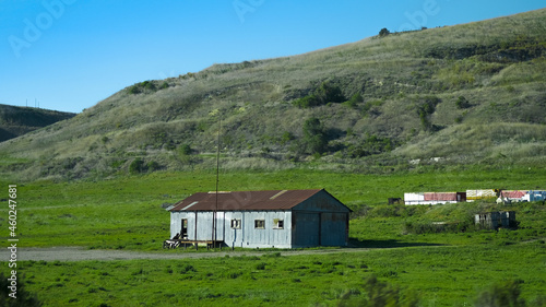 Abandoned barn in green hills
