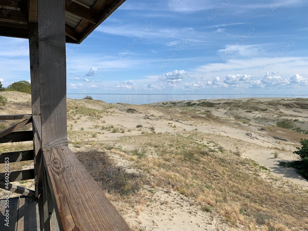 Beautiful dunes with seascape background, perfect surface of the sea