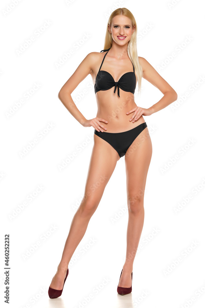 Young smiling blond woman posing in swimsuit Young smiling blond woman posing in swimsuit