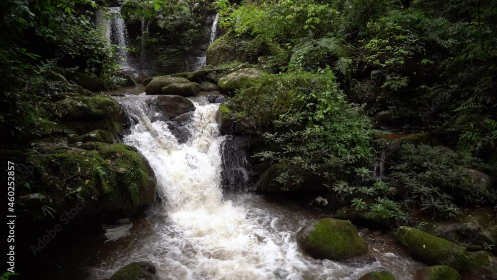 Sapan Waterfall, a famous waterfall of Nan Province A waterfall flows from a large rock in the rainy season. Sapan Waterfall, a famous waterfall of Nan Province A waterfall flows from a large rock in the rainy season.