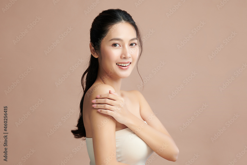 Beautiful young asian woman with clean fresh skin on beige background, Face care, Facial treatment, Cosmetology, beauty and spa, Asian women portrait. Beautiful young asian woman with clean fresh skin on beige background, Face care, Facial treatment, Cosmetology, beauty and spa, Asian women portrait.