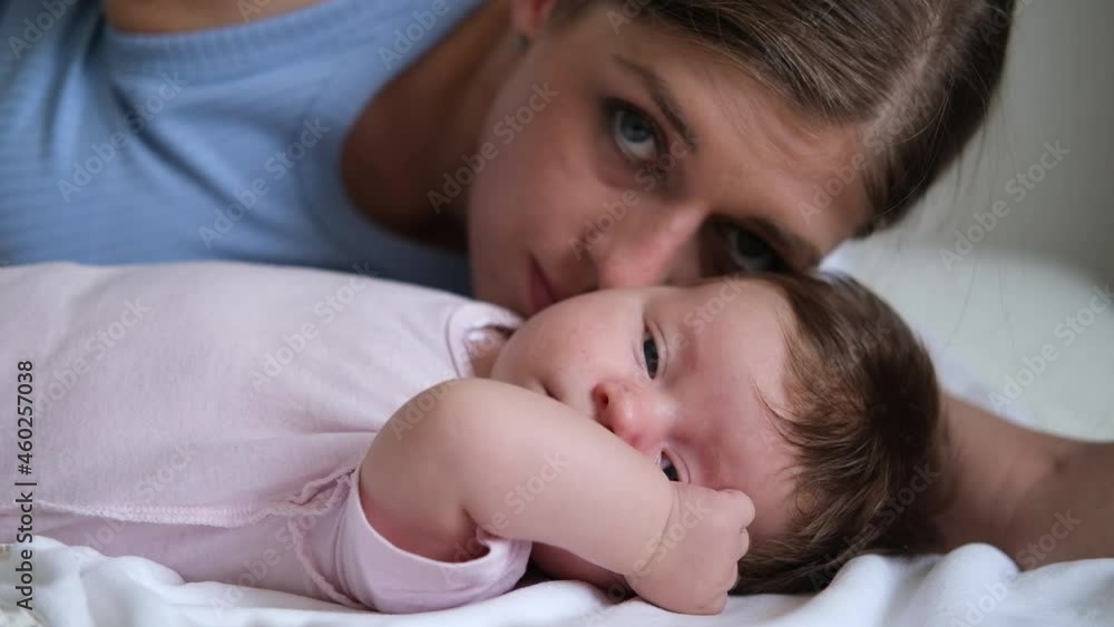 Attractive happy mothers face kiss little baby girl. Happy family Attractive happy mothers face kiss little baby girl. Happy family