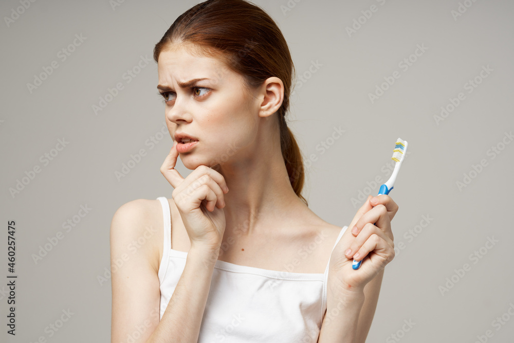 cheerful woman with a toothbrush in hand morning hygiene isolated background cheerful woman with a toothbrush in hand morning hygiene isolated background