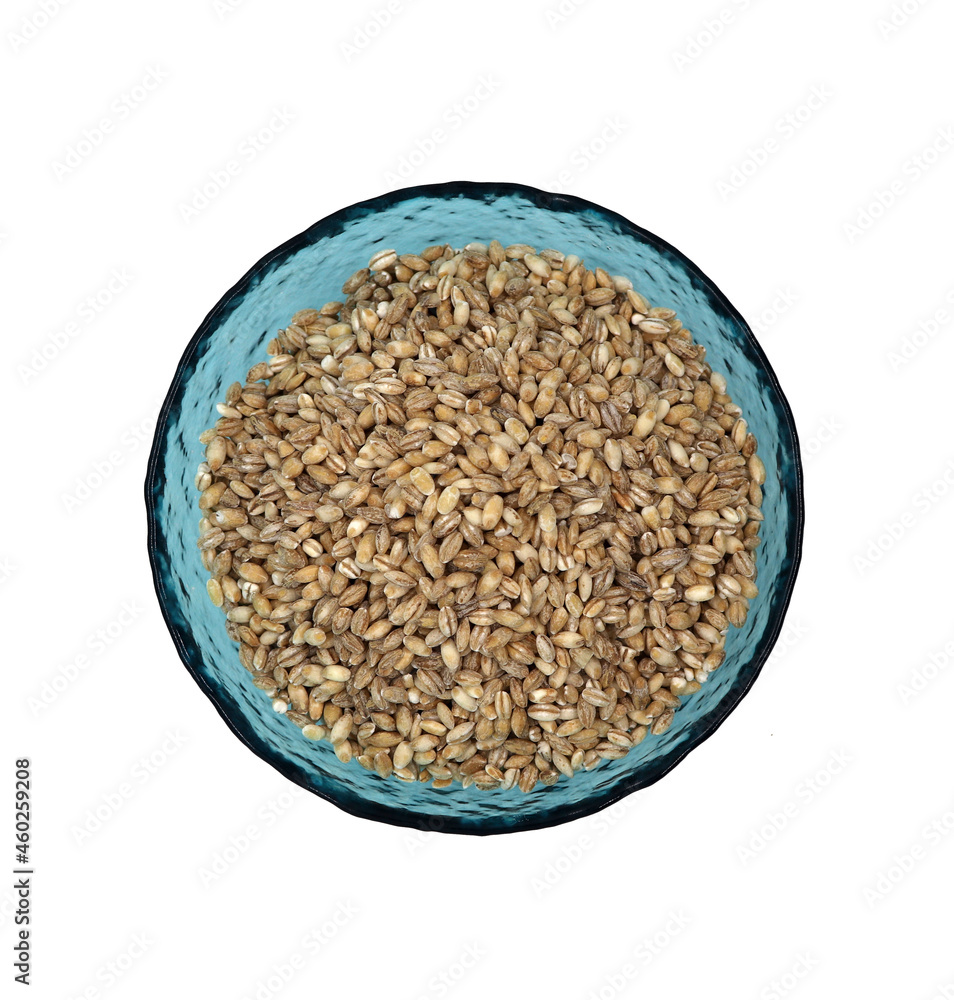 pearl barley in a blue bowl on a white background pearl barley in a blue bowl on a white background