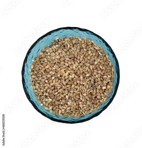 pearl barley in a blue bowl on a white background